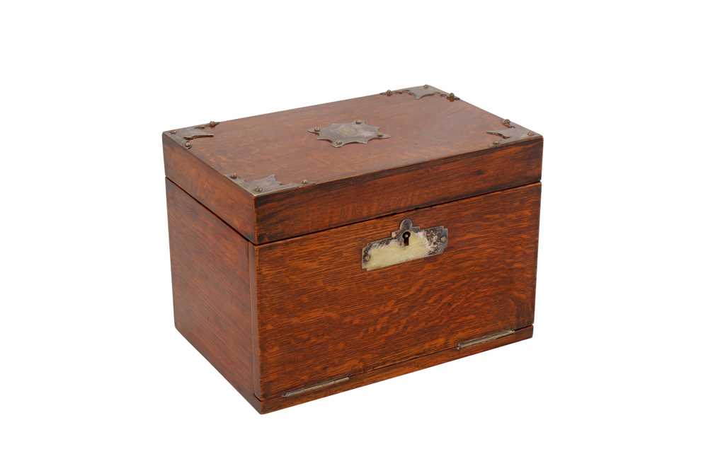Lot 449 - An Edwardian oak smoker's companion