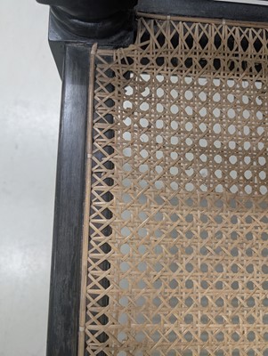 Lot 39 - An early 19th century Ceylon (Sri Lanka) carved and caned ebony sofa