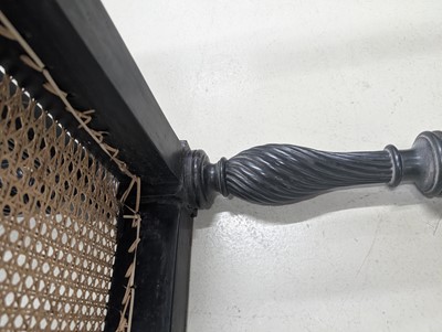 Lot 39 - An early 19th century Ceylon (Sri Lanka) carved and caned ebony sofa