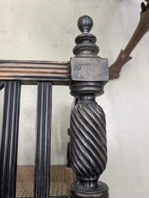 Lot 39 - An early 19th century Ceylon (Sri Lanka) carved and caned ebony sofa