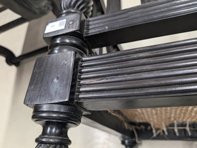 Lot 39 - An early 19th century Ceylon (Sri Lanka) carved and caned ebony sofa