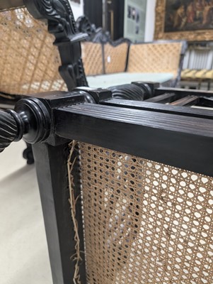Lot 39 - An early 19th century Ceylon (Sri Lanka) carved and caned ebony sofa