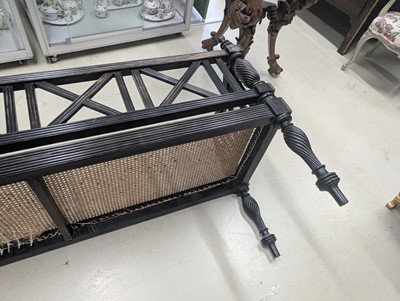 Lot 39 - An early 19th century Ceylon (Sri Lanka) carved and caned ebony sofa