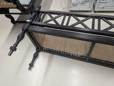 Lot 39 - An early 19th century Ceylon (Sri Lanka) carved and caned ebony sofa