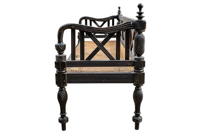 Lot 39 - An early 19th century Ceylon (Sri Lanka) carved and caned ebony sofa