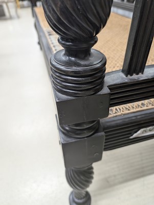 Lot 39 - An early 19th century Ceylon (Sri Lanka) carved and caned ebony sofa