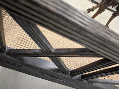 Lot 39 - An early 19th century Ceylon (Sri Lanka) carved and caned ebony sofa