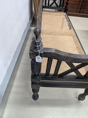 Lot 39 - An early 19th century Ceylon (Sri Lanka) carved and caned ebony sofa