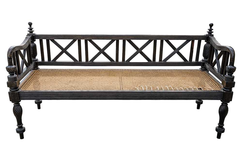 Lot 39 - An early 19th century Ceylon (Sri Lanka) carved and caned ebony sofa