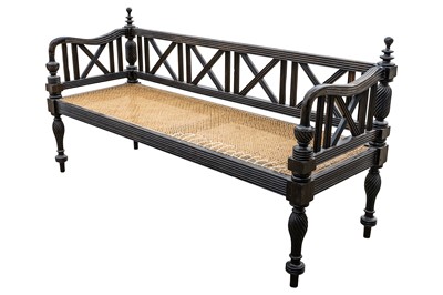 Lot 39 - An early 19th century Ceylon (Sri Lanka) carved and caned ebony sofa