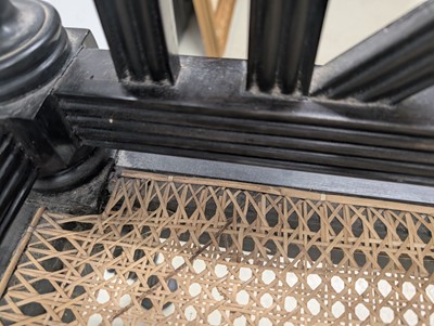 Lot 39 - An early 19th century Ceylon (Sri Lanka) carved and caned ebony sofa