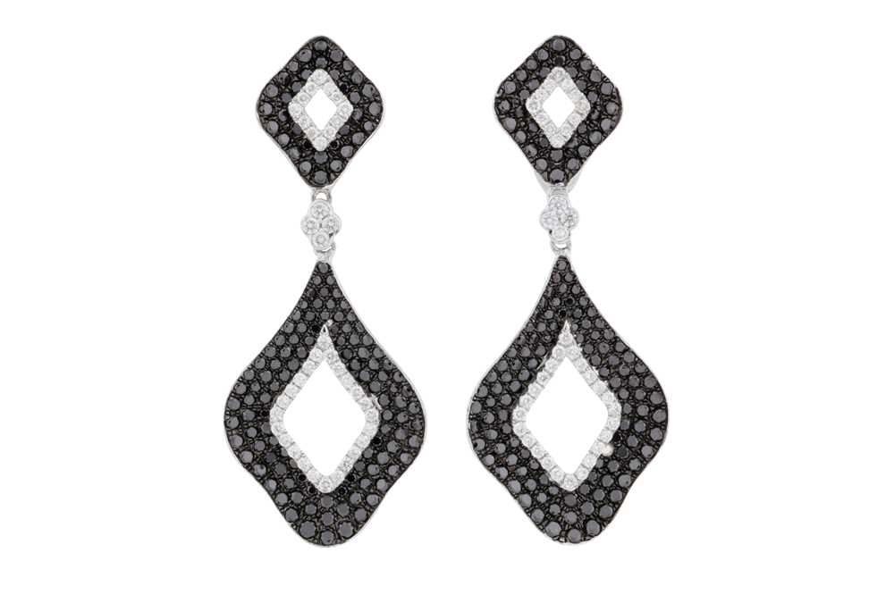 Lot 178 - A pair of black and white diamond earrings