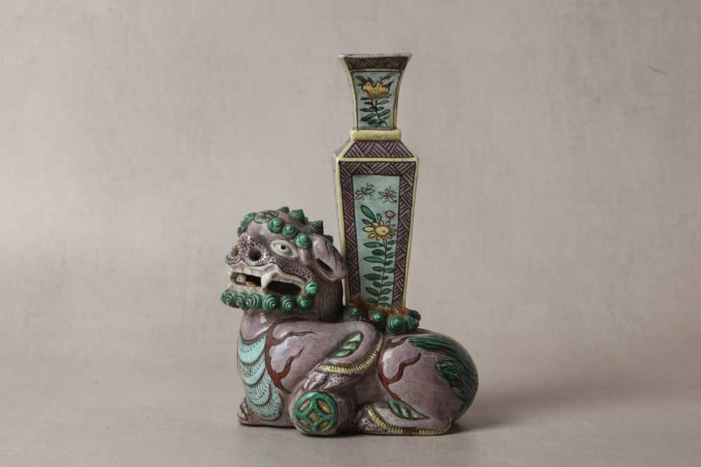 Lot 13 - A CHINESE BISCUIT FAMILLE-VERTE 'LION DOG' CANDLE HOLDER