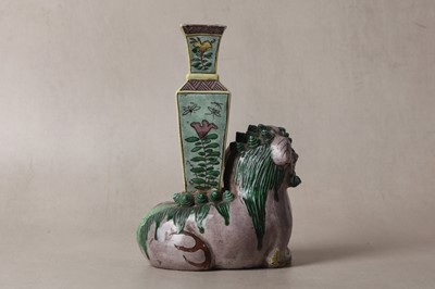 Lot 13 - A CHINESE BISCUIT FAMILLE-VERTE 'LION DOG' CANDLE HOLDER