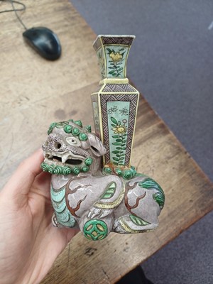 Lot 13 - A CHINESE BISCUIT FAMILLE-VERTE 'LION DOG' CANDLE HOLDER
