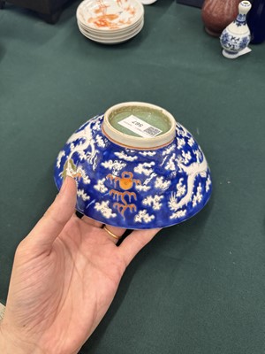 Lot 567 - FOUR CHINESE BLUE-GROUND 'DRAGON' BOWLS