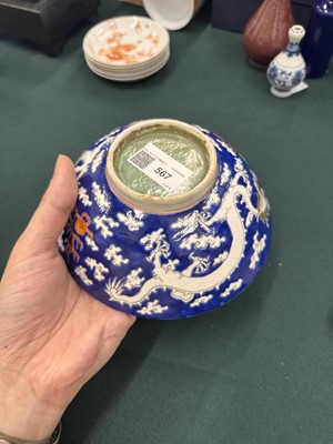 Lot 567 - FOUR CHINESE BLUE-GROUND 'DRAGON' BOWLS