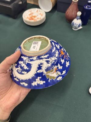 Lot 567 - FOUR CHINESE BLUE-GROUND 'DRAGON' BOWLS