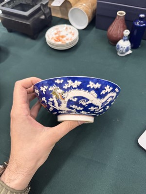 Lot 567 - FOUR CHINESE BLUE-GROUND 'DRAGON' BOWLS