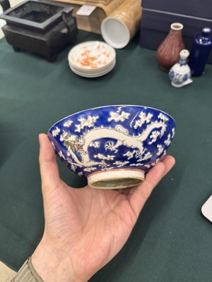 Lot 567 - FOUR CHINESE BLUE-GROUND 'DRAGON' BOWLS