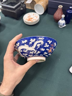 Lot 567 - FOUR CHINESE BLUE-GROUND 'DRAGON' BOWLS