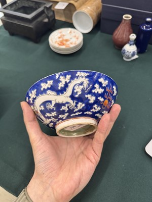 Lot 567 - FOUR CHINESE BLUE-GROUND 'DRAGON' BOWLS