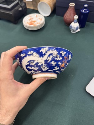 Lot 567 - FOUR CHINESE BLUE-GROUND 'DRAGON' BOWLS
