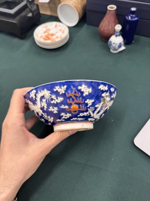 Lot 567 - FOUR CHINESE BLUE-GROUND 'DRAGON' BOWLS