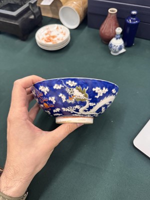Lot 567 - FOUR CHINESE BLUE-GROUND 'DRAGON' BOWLS