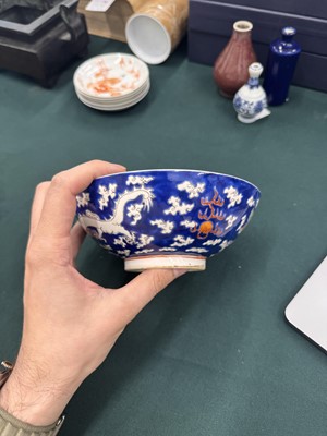 Lot 567 - FOUR CHINESE BLUE-GROUND 'DRAGON' BOWLS