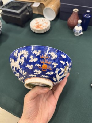 Lot 567 - FOUR CHINESE BLUE-GROUND 'DRAGON' BOWLS