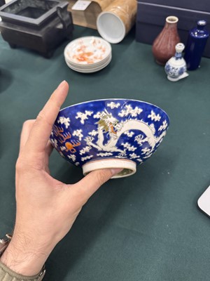 Lot 567 - FOUR CHINESE BLUE-GROUND 'DRAGON' BOWLS