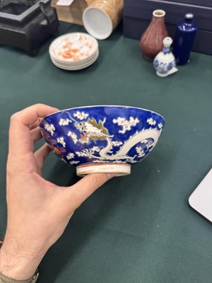 Lot 567 - FOUR CHINESE BLUE-GROUND 'DRAGON' BOWLS