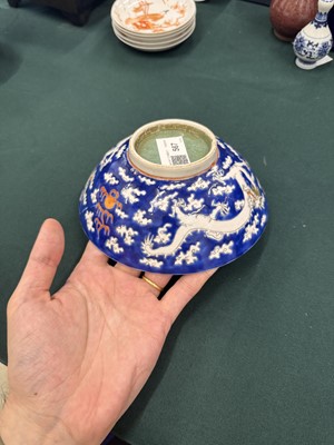 Lot 567 - FOUR CHINESE BLUE-GROUND 'DRAGON' BOWLS