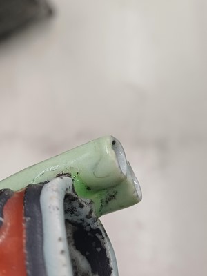 Lot 425 - Three Chinese biscuit famille-verte models of shoes, Qing dynasty, Kangxi period