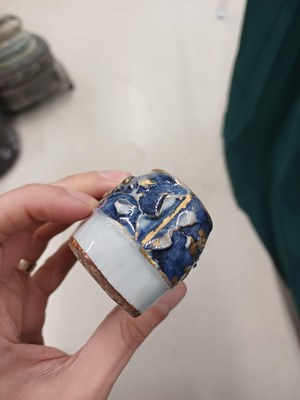 Lot 425 - Three Chinese biscuit famille-verte models of shoes, Qing dynasty, Kangxi period