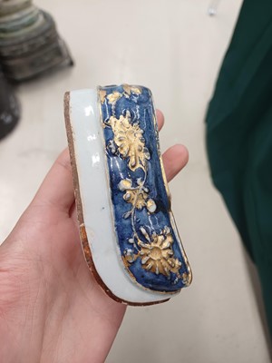 Lot 425 - Three Chinese biscuit famille-verte models of shoes, Qing dynasty, Kangxi period