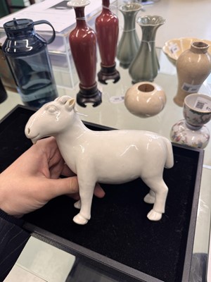 Lot 476 - A Chinese white-glazed figure of a ram, Qing dynasty, Qianlong period