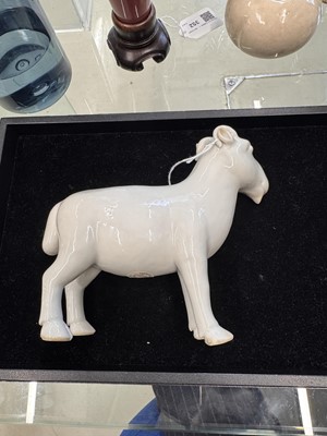 Lot 476 - A Chinese white-glazed figure of a ram, Qing dynasty, Qianlong period
