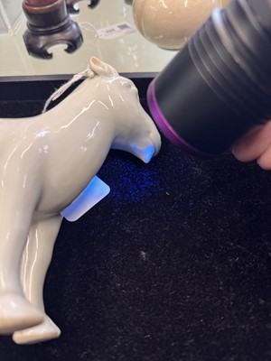 Lot 476 - A Chinese white-glazed figure of a ram, Qing dynasty, Qianlong period