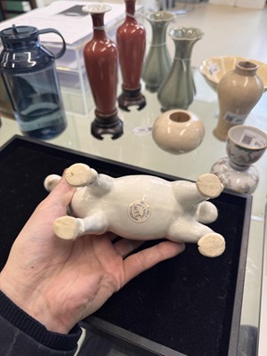 Lot 476 - A Chinese white-glazed figure of a ram, Qing dynasty, Qianlong period