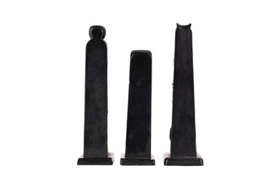Lot 81 - A GROUP OF THREE NORTH AMERICAN INDIGENOUS CARVED SLATE (ARGILLITE) TOTEMS