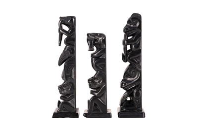 Lot 81 - A GROUP OF THREE NORTH AMERICAN INDIGENOUS CARVED SLATE (ARGILLITE) TOTEMS