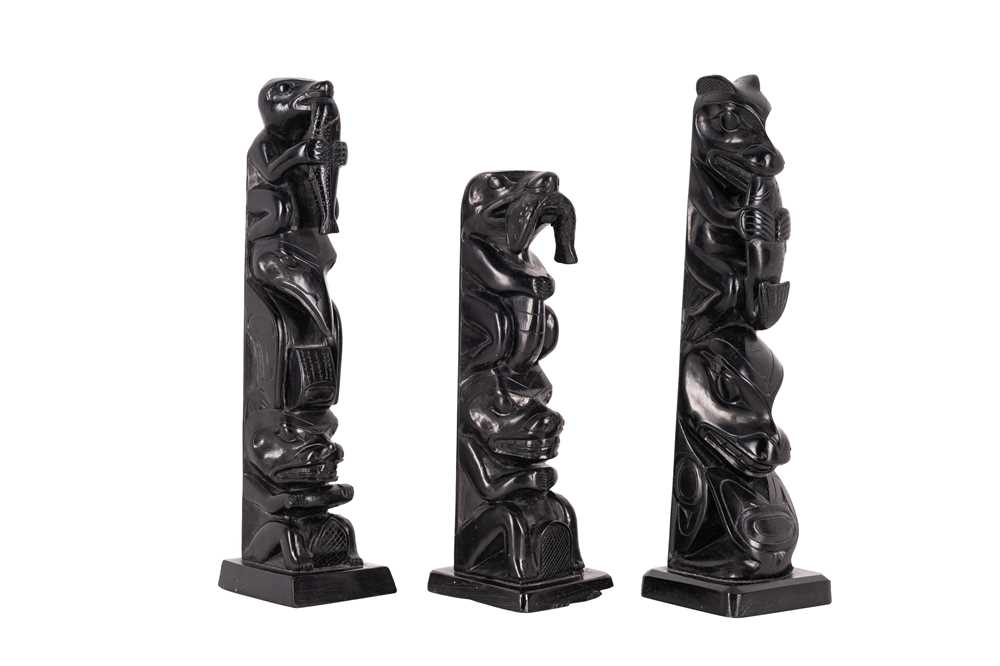Lot 81 - A GROUP OF THREE NORTH AMERICAN INDIGENOUS CARVED SLATE (ARGILLITE) TOTEMS