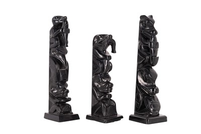 Lot 81 - A GROUP OF THREE NORTH AMERICAN INDIGENOUS CARVED SLATE (ARGILLITE) TOTEMS
