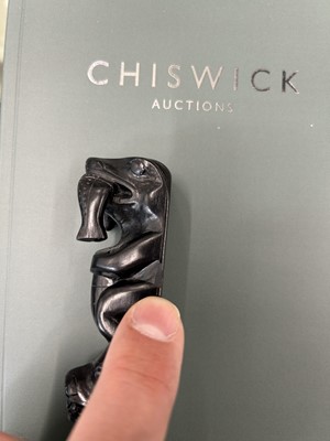 Lot 81 - A GROUP OF THREE NORTH AMERICAN INDIGENOUS CARVED SLATE (ARGILLITE) TOTEMS