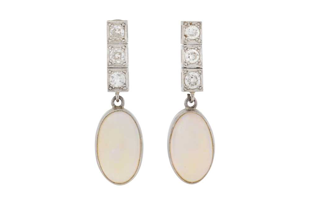 Lot 37 - A pair of moonstone and diamond pendent earrings