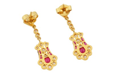 Lot 125 - A pair of ruby and diamond pendent earrings