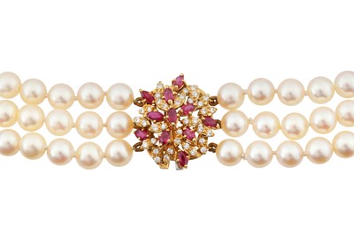Lot 118 - A three-strand pearl choker necklace, circa 1982