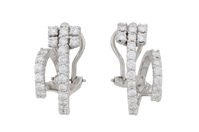 Lot 224 - A pair of diamond scroll earrings